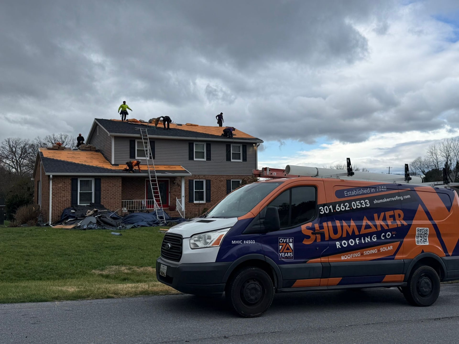 Aerial view of a neighborhood roof Shumaker Roofing serves